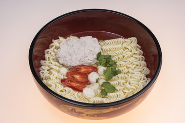 High angle view of noodles and other ingredients in a bowl