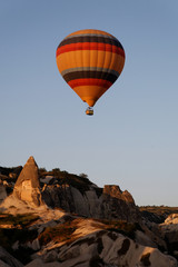 Fototapeta na wymiar Hot air balloon flying over a fairy chimney
