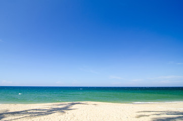 tropical sandy beach at sunny day.blue sky and torquise sea water. ideal for travel and vacation background