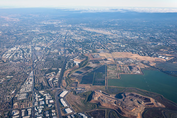 Aerial view of Redwood Shores State Marine Park and Foster city from airplane window. San Francisco. California. USA