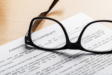 Close up shot of Eyeglasses  on document papers business concept