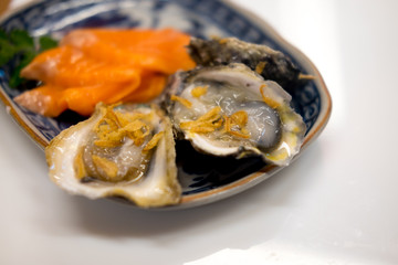 Tasty fresh oysters on plate.