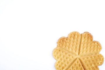 Festive breakfast composition with homemade waffles in the shape of heart for valentine's day.