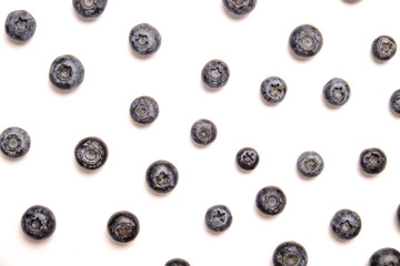 Bunch of fresh organic blueberry berries in seamless pattern on white background. Clean eating concept. Healthy nutritious vegan snack, raw diet. Close up, copy space, top view, flat lay.
