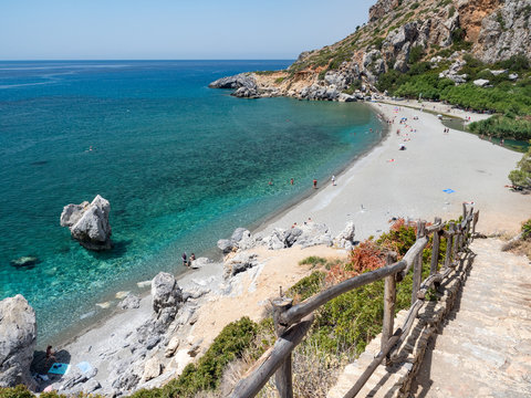 Preveli Beach with a lot of Palms in the park on Crete island, Greece. June, 2018