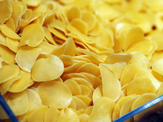 Raw Dried fish and prawn cracker slices in bulk, close-up shot