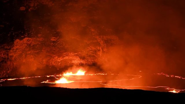 Lava lake in the active Kilauea volcano with bubbling hot lava and smoke, Big Island, Hawaii
