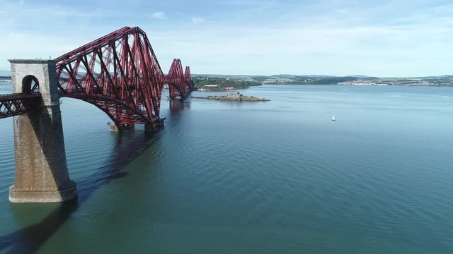 4K aerial footage of the iconic Victorian cantilever railway bridge across the Firth of Forth near Edinburgh.