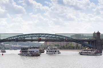 View of the glass bridge over the Moscow river with passenger ships