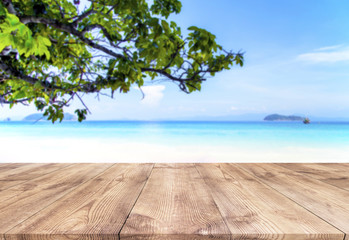 Wood table with blue sea and sand beach background