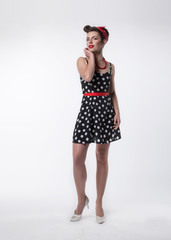 beautiful young woman in polka dot dress