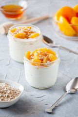 Couple Of Cups Of Homemade Yogurt With Poached Peach