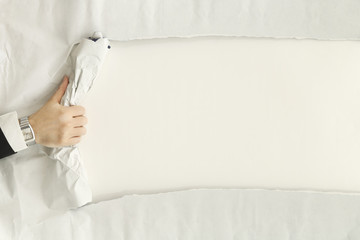 ripping a paper sheet