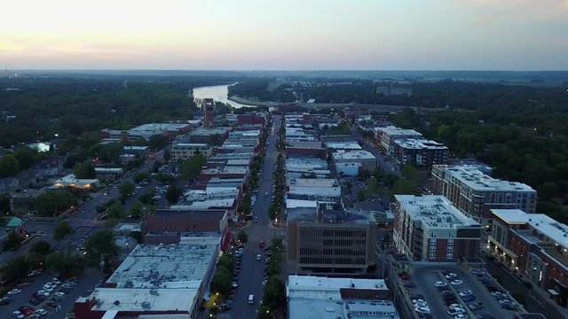 Drone Flight over Downtown Street towards River