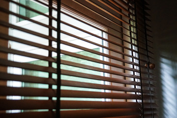 brown wood blind shade curtain and shadow