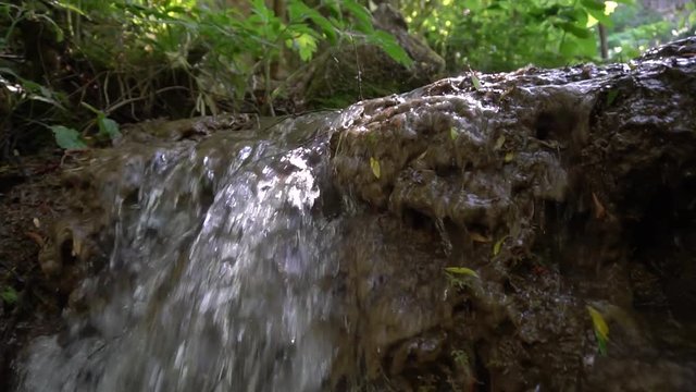 Footage of stream river at the waterfall. Slow motion