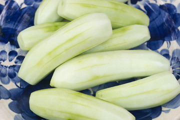 peeled cucumbers on plate