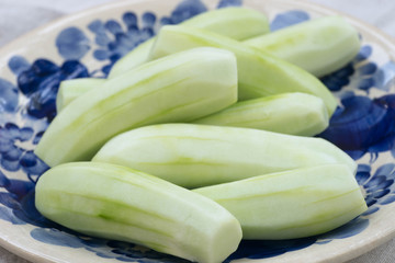 peeled cucumbers on plate