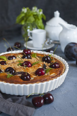 Homemade almond and cherries cake, baked cream with honey and peaches and prunes