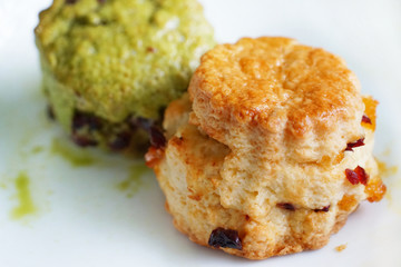 Two scone on white plate.