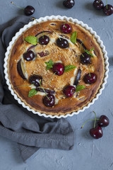 Homemade almond and cherries cake, baked cream with honey and peaches and prunes