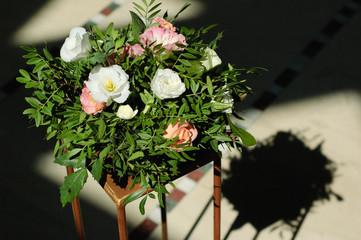 Flower arrangement on a gold stand