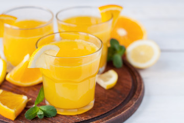 Refreshing citrus drink with sliced lemon and orange