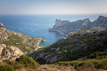 Fototapeta na wymiar Aerial landscape view on calanque of Sormiou with boats sailing in the beautiful turquoise Mediterranean sea. Marseille, Cassis, Provence, France