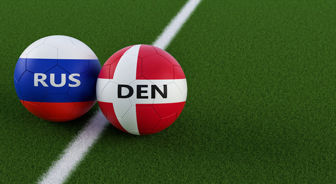 Denmark vs. Russia Soccer Match - Soccer balls in Denmarks and Russia national colors on a soccer field. Copy space on the right side - 3D Rendering 