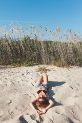Young woman enjoying alone on the beach