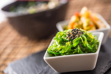 Wakame salad with seaweed and sesame seeds. © weyo