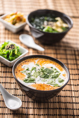 Traditional thai soup Tom Yum with shrimp and coconut milk