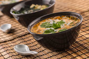 Traditional thai soup Tom Yum with shrimp and coconut milk