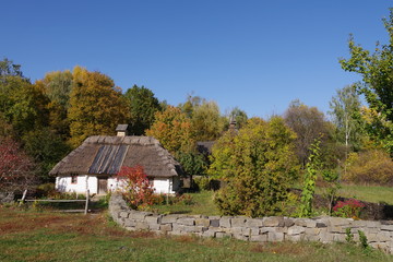 house with white walls and thatched roof