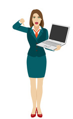 Businesswoman holding a laptop notebook and showing thumb down gesture as rejection symbol