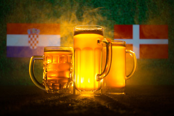 Soccer 2018. Creative concept. Beer glasses on grass. Support your country with beer concept.