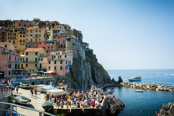 Fototapeta na wymiar The Town of Manarola builded on the Cliff in a Summer Day