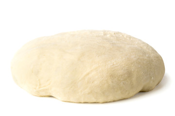 Raw dough on a white, close-up.