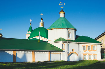 Fototapeta na wymiar Orthodox monastery and church in the setting sun at Cheboksary, Russia.