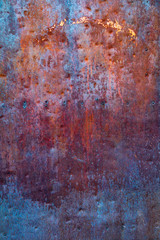 Background. The texture of the old rusty metal plate with cracks and rivets
