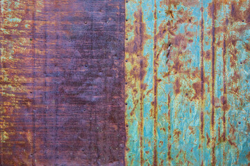 Background. The texture of the old rusty metal plate with cracks and rivets