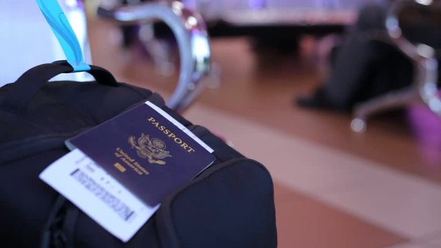 One single blue American passport on a backpack