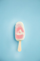 Popsicle with fresh raspberry on a table