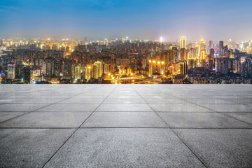 Panoramic skyline and buildings with empty concrete square floor