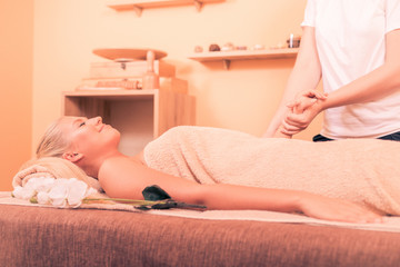 Obraz na płótnie Canvas Girl having massage in spa