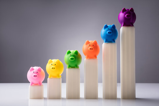 Multi Colored Piggybanks On Top Of Increasing Graphs