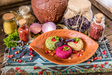 Traditional Georgian cuisine snacks - rolls of eggplant and 