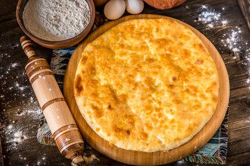 Traditional Georgian khachapuri on the table. Homemade baking