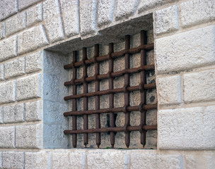 Prison of the Palazzo Ducale in Venice. Iron bars on the window of the old prison. Rusty prison bars