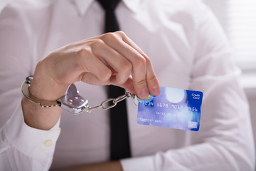 An Arrested Person Hand Linked To Credit Card